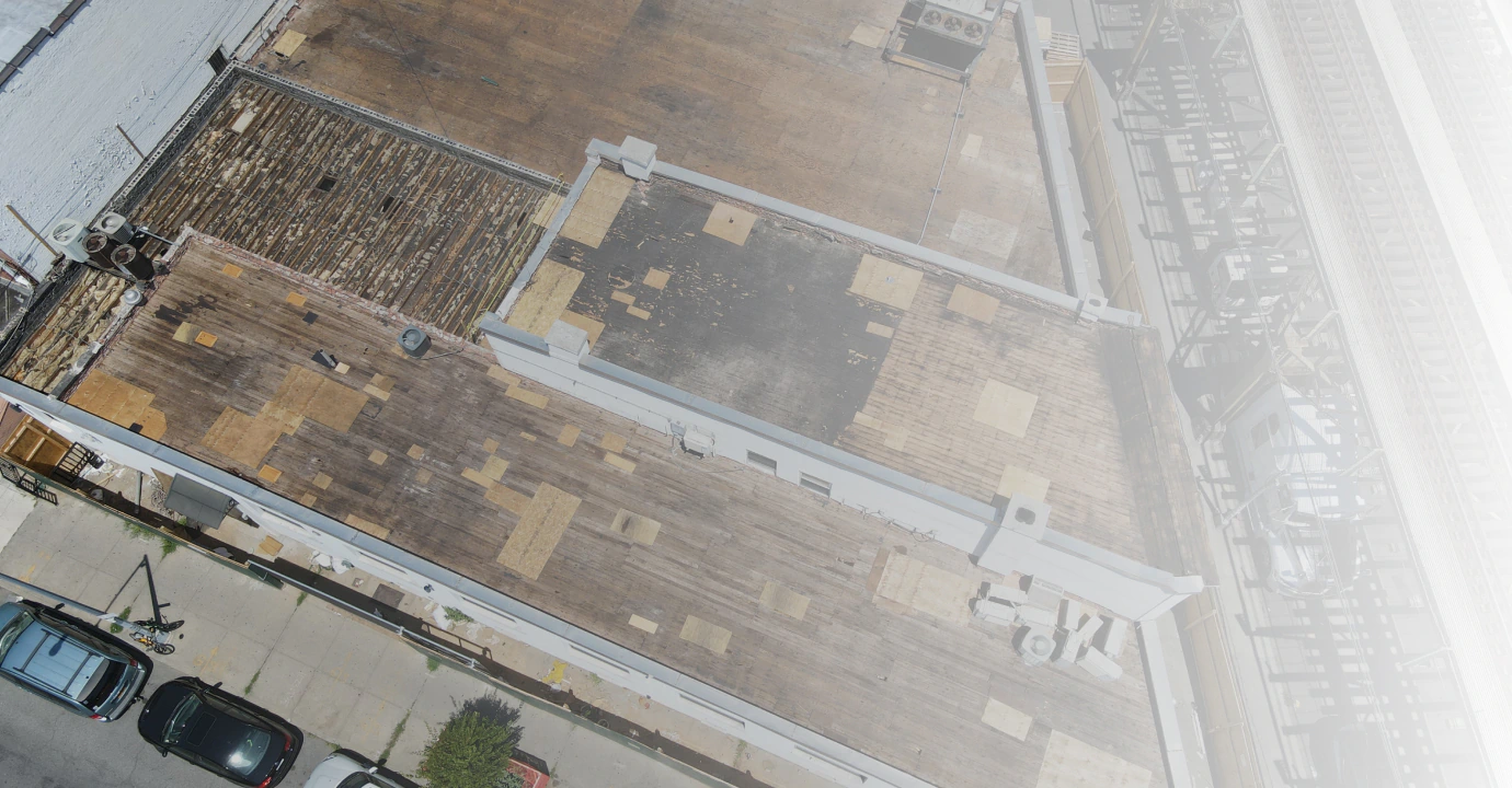 wooden warehouse roof in need of repair